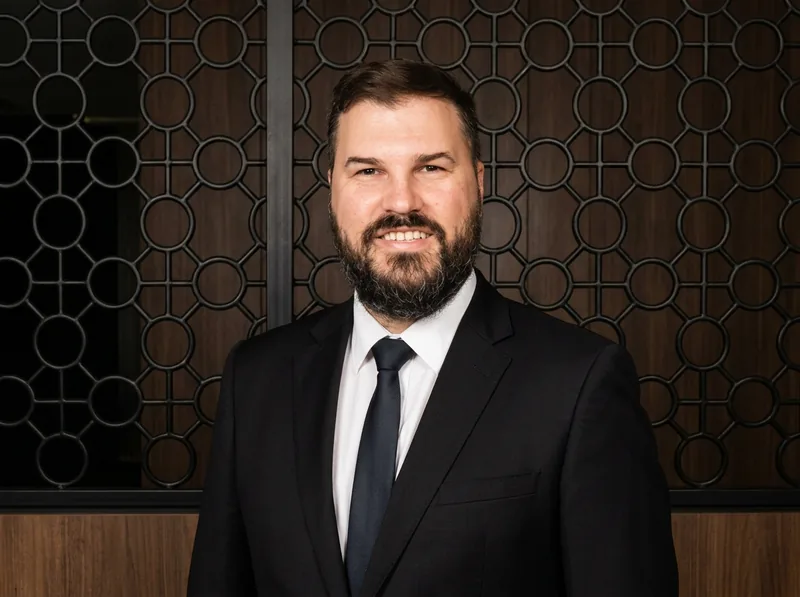 Jack, founder of Brisbane Wedding DJ, in a suit and tie
